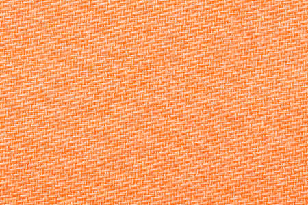 Orang fabric background texture. Detail of textile material close-up.