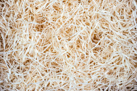 Wood background. Close up of wooden shavings for packingの写真素材