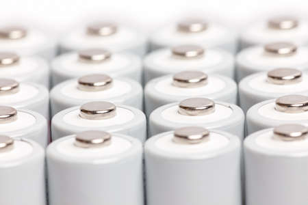 AA batteries are close to each other. Close-up of white batteries on a white background. Battery...