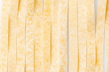 Raw food Italian Macaroni. Pasta on white background. Close-up.の写真素材