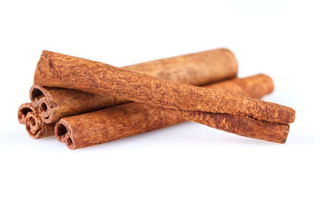 Fragrant cinnamon sticks isolated on white background. Close-up.