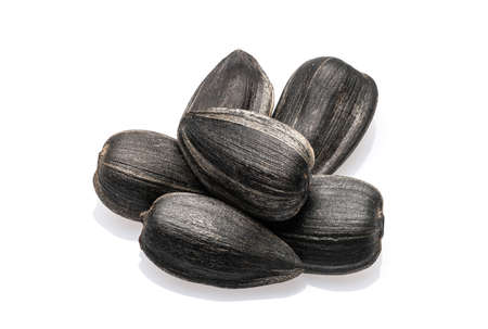 Sunflower seeds isolated on white background. Close-up. Full depth of field.