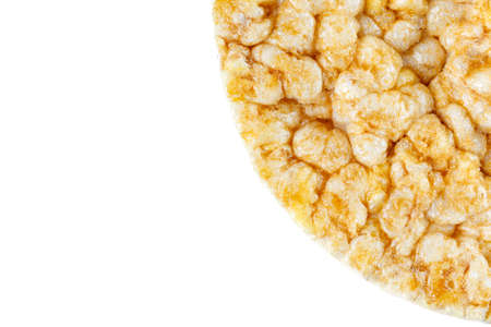 Caramelized corn cakes. Puffed whole grain crispbread isolated on white background. Close up.の写真素材