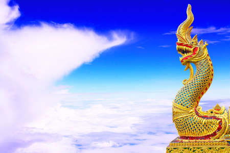 Thai dragon or king of Naga statue on blue sky background
