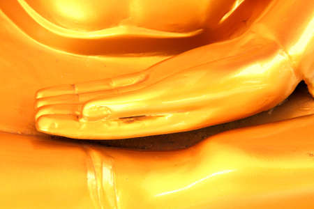 Hand of golden Buddha statues in temple  の写真素材
