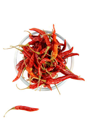 Dried red chili peppers in a glass bowl