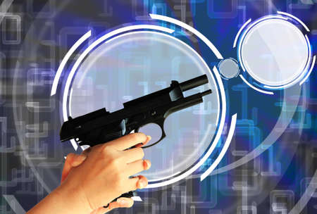 gun in hand with digital blue backgroundの写真素材