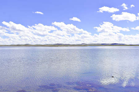 Clouds in the sky & clear lake sceneryの写真素材