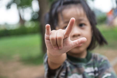 Girls making out hand gesture の写真素材