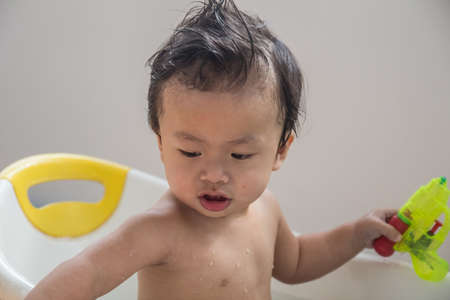 The boy was taking a showerの写真素材