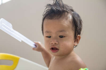 The boy was taking a showerの写真素材