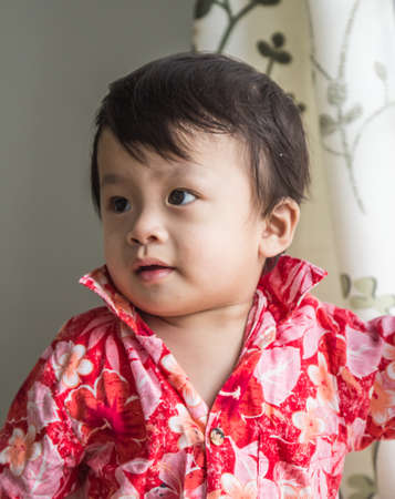 Boy wearing flower