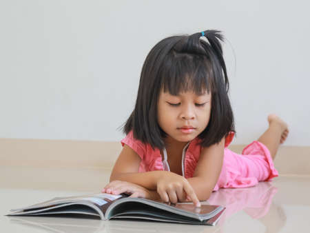 Little girl reading pleasure の写真素材