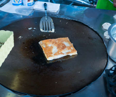 Roti in black pan on market,の写真素材