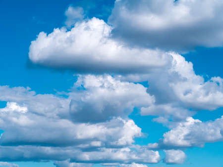 Light in the clouds on blue sky, The stormy and fluffy clouds shined from above with the sunlight,...