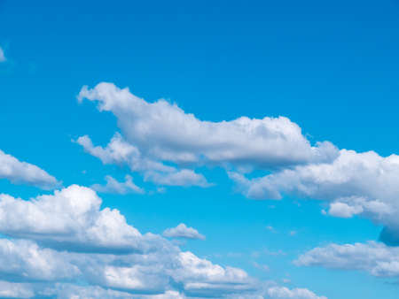 Light in the clouds on blue sky, The stormy and fluffy clouds shined from above with the sunlight, view from airplane Windows.の写真素材