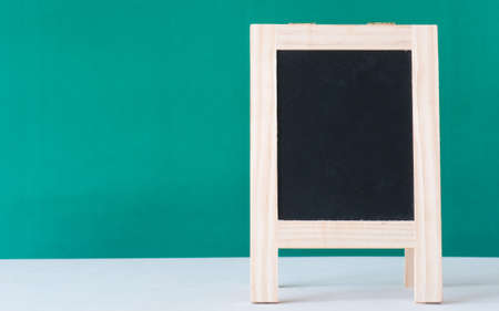 Black board on green background,の写真素材