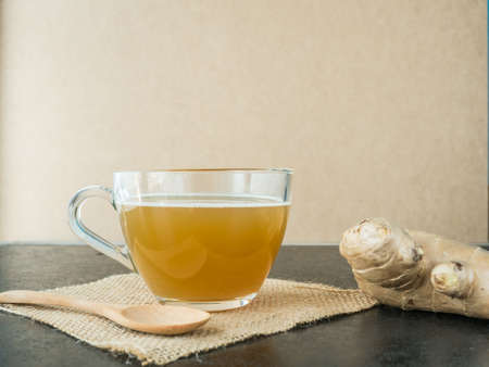 Water ginger in glass on black table background,の写真素材