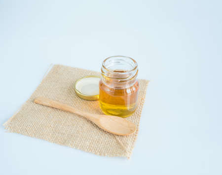 honey bee in jar on white background, sack background,の写真素材