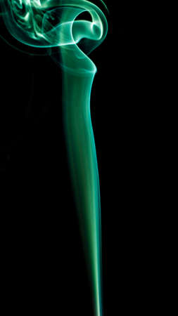 Green smoke on black background,の写真素材