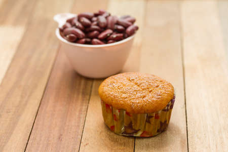Banana cup cake on table, red bean in cup background.