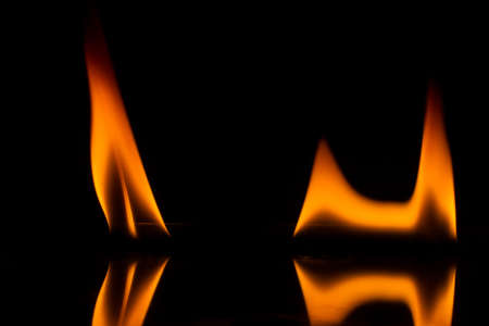 Yellow fire flames on black background,の写真素材