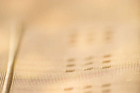 Orange fabric texture. Orange cloth background. Close up view of yellow fabric texture and background. Abstract background and texture for designers.の写真素材