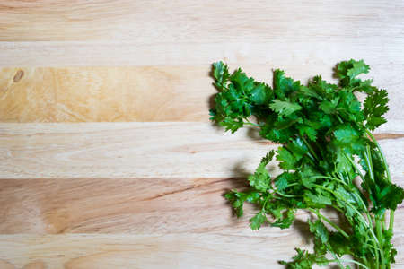 parsley on wooden background,の写真素材