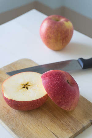 Slice apple on chopping blockの写真素材