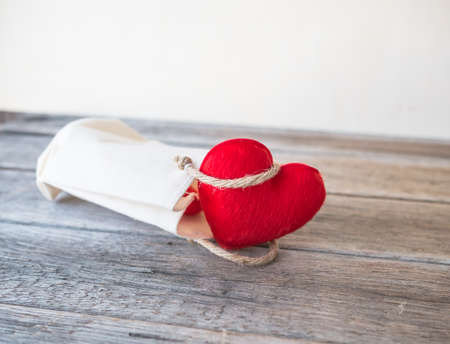 Red heart on white bag,の写真素材