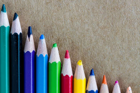 Beautiful colored pencils on wooden backgroundの写真素材