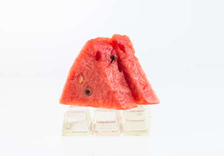 Watermelon on ice and white background, red slice watermelon,の写真素材