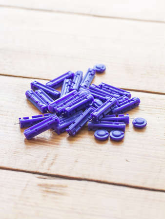 patient measuring glucose level blood test on wooden background, needle level blood test,の写真素材