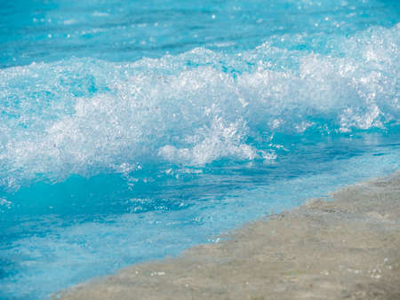 Blurred water background, water in the blue, white wave water on beautiful, wave water pool floor,の写真素材