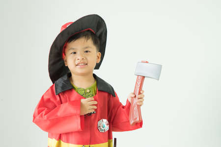 Children wearing fire extinguishers holding axe on white background,の写真素材