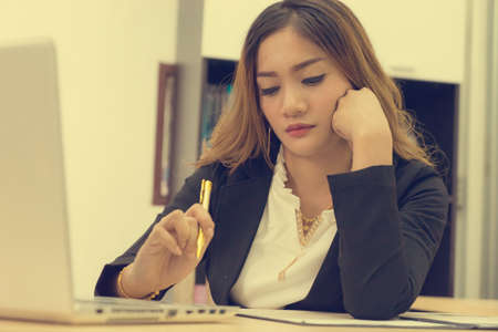 Business women are sitting using the idea of work, vintage image,