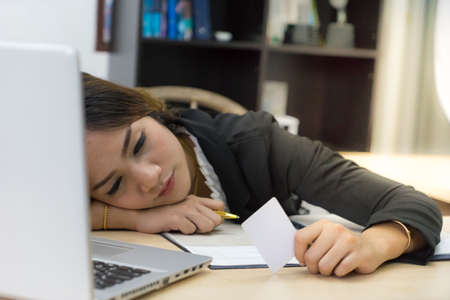White business card holders holding and sleeping think on table in office,の写真素材