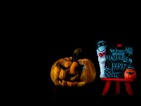 Welcome halloween party notice board on black background, blurred image pumpkin front Halloween party,の写真素材