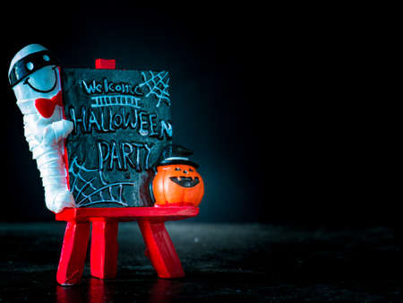 Welcome halloween party notice board on black background,の写真素材