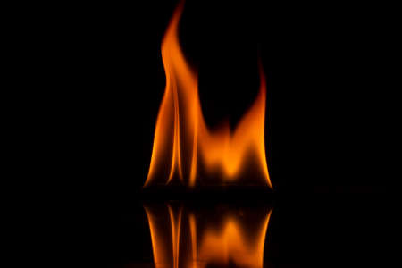 Yellow fire flames on black background,の写真素材