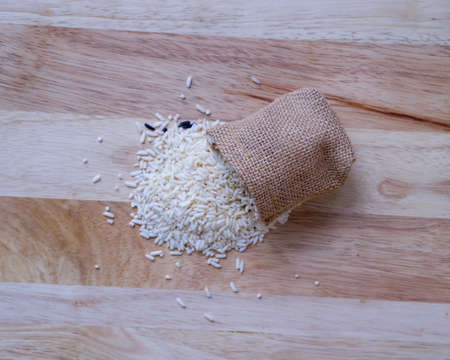 sack on blurred rice background, top view image,の写真素材