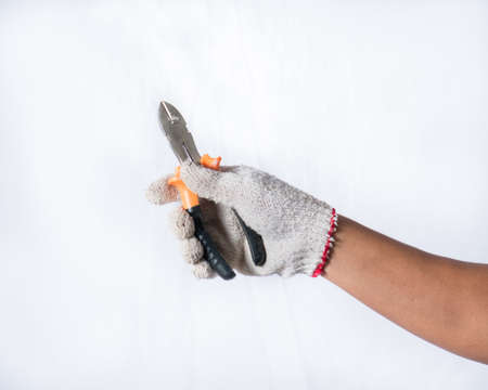 Wire clamp in hand on white background,の写真素材