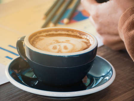 Hot coffee vintage image on blurred pencil background,の写真素材