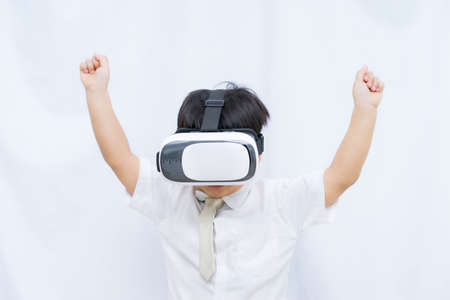 Little boy wear 3D goggles on white background,