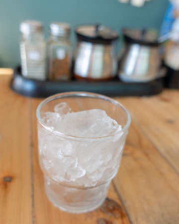Ice in glass on the table background,の写真素材