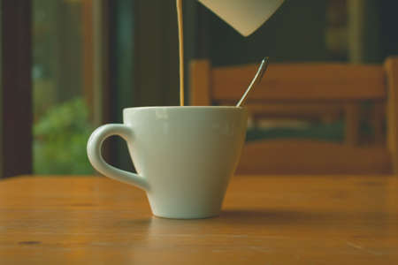 Hot coffee in the white cup on  vintage image,の写真素材