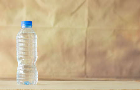 Bottle water on the wall wintage background,