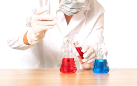 Blood in a glass bottle in a laboratory bottle on white isolate background,