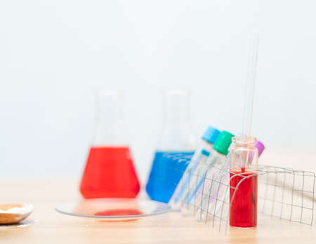 Blood is in a glass tube on a table in a lab room,