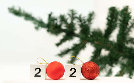 2020 year numbers at blurred Christmas tree background. 2020 year trends concept.の写真素材